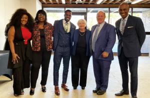 A group photo of Jalissia, Terra Carter, Milton Putman, Madame Secretary Janet Yellen, Detroit Mayor Mike Duggan, and Kevin Johnson at the CIM TUKAcenter in Detroit