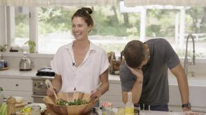 Cayley and Brandon Jenner in their kitchen making a plant-based recipe.