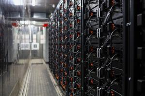 An internal view of Wattstor's battery energy storage system showing lithium-ion batteries in racks