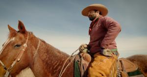 A photo of a man on a horse from the film Beyond The Soil by Jaime Jacobsen & Eric Forbes.
