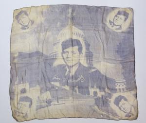 Lot 307 is a rare 1952 silk scarf promoting JFK’s U.S. Senate bid, 30 by 33 inches, with images of Kennedy (est. $500-$1,000).