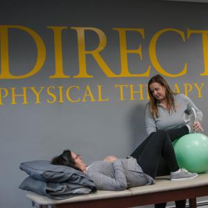 Laura Bucci, PT, DPT working with patient