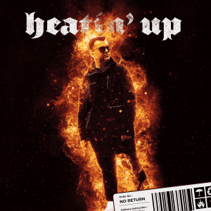 Cover art featuring JoshDeanSavage standing amidst flames, symbolizing Rise, Fall, and Rebirth. He is set against a black background, illuminated by the fire, with embers and ash floating around him. The text 'Heatin' Up' is prominently displayed.