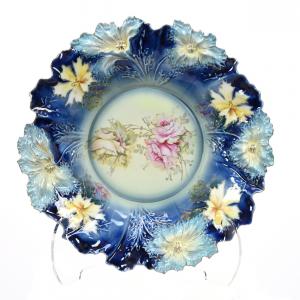 Unmarked R.S. Prussia center bowl in the Carnation mold, 15 inches in diameter, having an incredible cobalt blue and light blue with pink and yellow rose décor (est. $1,500-$3,500).