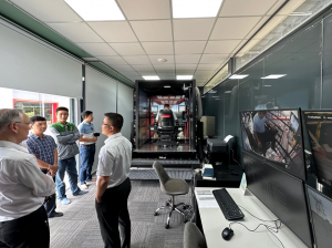 Vietnam conference attendees watch live crane simulation training on GlobalSim's Full Mission.