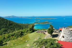 Scenic panorama from The Windmill Bar St. John, overlooking crystal-clear waters and lush landscapes, ideal for VI Jam Fest music festival.