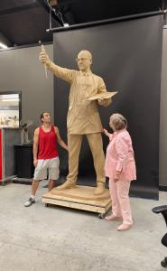 Master Sculptor Benjamin Victor with Carol Peck-Hill viewing the Dr. Peck Bronze Memorial final clay stage in studio.
