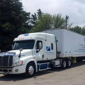 View of a Modern Training Ontario truck with branded graphics