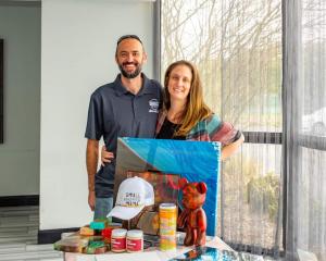 At a recent community event, League City HFA owners Jesse and Danielle Fanning displayed artwork and gifts available at their studio