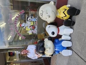 The Peanuts Gang in front of The Needful Things Emporium
