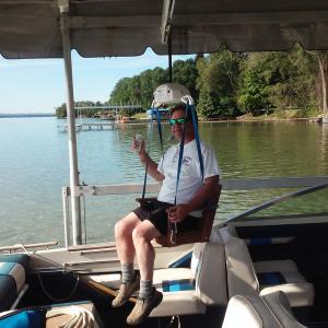 Handicaptain is a mechanically operated lift that comfortably and safely moves people (or pets) from dock to boat and back again.