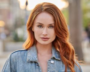 a woman in a natural light headshot outside in the Los Angeles area.