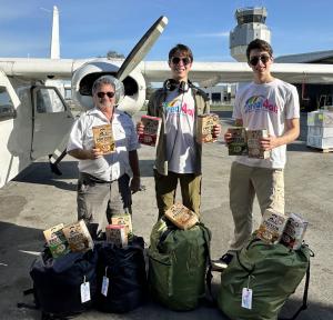 Founders of national nonprofit Cereal4all Luke and Jett Justin load up cereal for an Oatmeal Airlift flight to the Bahamas to fight food insecurity on the island of Grand Bahama