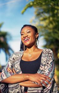 Black psychologist crossing hands and smiling happily