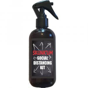 8 ounce bottle with skunk um social distancing kit written on it