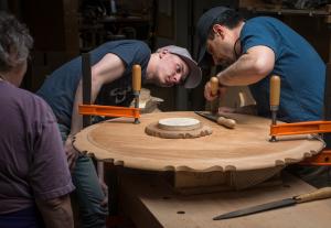 Men working on designing furniture