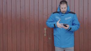 jacket with built-in heating system controllable from phone or remote