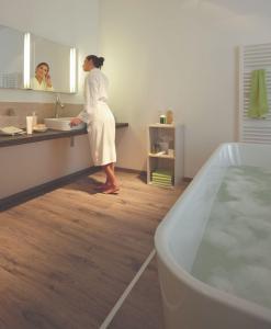 EGGER Laminate Flooring with Aqua+ technology installed in luxury apartment bathrooms