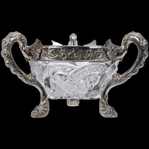 American Brilliant Cut Glass centerpiece in the Crystal City pattern (aka Wedding Ring) by J. Hoare, with three handles and sterling silver rim with winged serpent handles and feet (est. $20,000-$25,000).