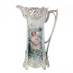 Perfect example unmarked R.S. Prussia tankard with a winter scene portrait, 13 inches tall, white and green with pale pink tones, having a satin finish and nice gold trim (est. $2,000-$3,500).