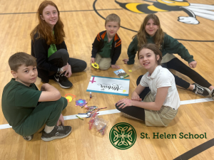 St Helen School Open House, children smiling on gym floor