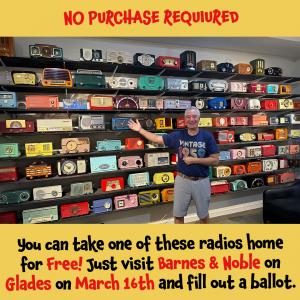 Author Aaron Zevy stands in front of some of his radio collection in his home radio museum in Boca Raton, Florida