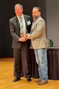 Logistics Recycling CEO, Brent DuBois, accepting the 2024 Weyenberg Prize for business excellence.