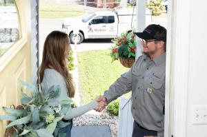 Modern Technician greeting a homeowner