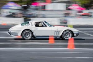 A white vintage Corvette on the autocross track