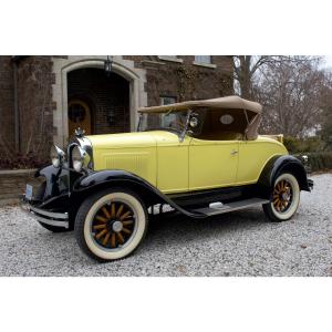Sporty black and yellow 1929 Whippet Model 96A four-cylinder roadster with advancements like pump-circulated cooling and full-pressure oiling (CA$25,960).