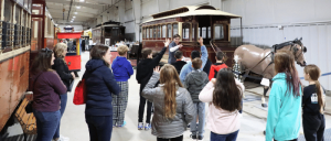 Adults and children exploring the Pennsylvania Trolley Museum.