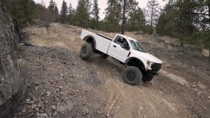 KXI Wildertec vehicle on hill while off pavement.