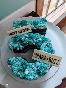 Strategic communications consultancy Spark + Buzz offering branding, marketing and public relations services, commemorates five years in business with a custom number cake.