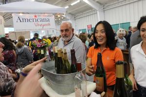 Individuals in line to sample wine at the Hudson Valley Wine & Food Festival