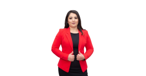 hispanic woman standing up wearing a red suit with long black hair