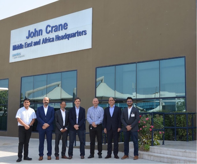 Representatives from X-NOOR and John Crane Middle East FZE stand in front of the John Crane regional headquarters in Dubai, marking the beginning of a transformative partnership in renewable energy.