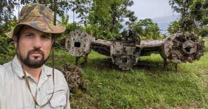 Pacific Wrecks founder Justin Taylan with World War II aircraft wreckage