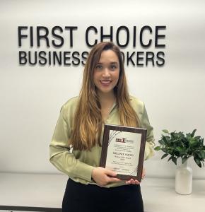 Image of Melanie Smith holding an award