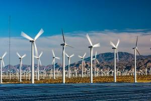 US landscape with solar panels and wind turbines