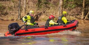 Fluid Watercraft's Swift Water Rescue 13 on the water with first responders