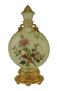 Large, rare Mintons Porcelain Vase and Cover c.1885, the yellow ground body decorated with enameled sprays of flowers, with a 22ct gilded lid, all on a large 22ct gilded ornate pierced base (est. $300-$500).