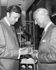 John Meier in 1970 autographing a copy of Speaking for the Earth for Thomas E. Murray Jr., whose father was the Commissioner of the United States Atomic Energy Commission (AEC)