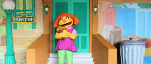 Julia holding a stuffed toy at Sesame Place Parks.