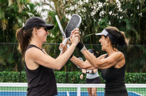 Pickleball players with gamma paddles