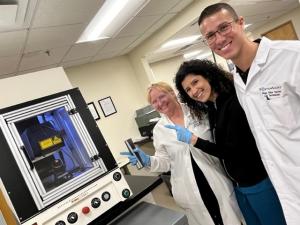 Eye care doctors in the BostonSight lens manufacturing lab