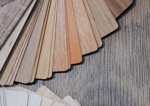 Swatches of wood colors on a hardwood floor.