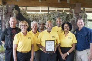 The Fort Mose Historical Society receives an award during a volunteer appreciation event at Colt Creek State Park on March 15, 2024.