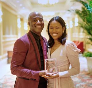 Dr. Chisholm and Spouse holding Trio Award at Award Ceremony