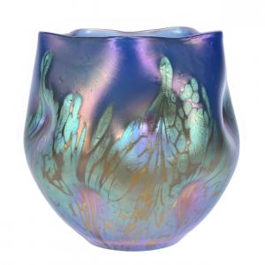 Unmarked, circa 1902 Loetz vase in the Medici pattern, blue opal with fantastic iridescence, dimpled sides and a polished pontil base, 5 ¼ inches in height (est. $2,000-$3,500).