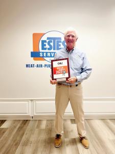 Tommy Estes holding a plaque of Best of Georgia 2023